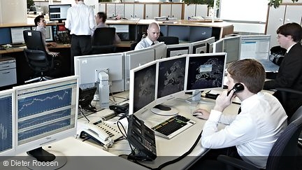 Photo shows People and monitors