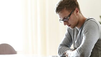 A student reading the newspaper
